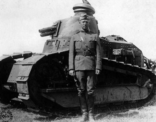 General Patton standing in front of tank