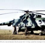 CIA Special Activities Division officers stand beside the Russian Mi-17 they used for transport int he early days of the American presence in Afghanistan